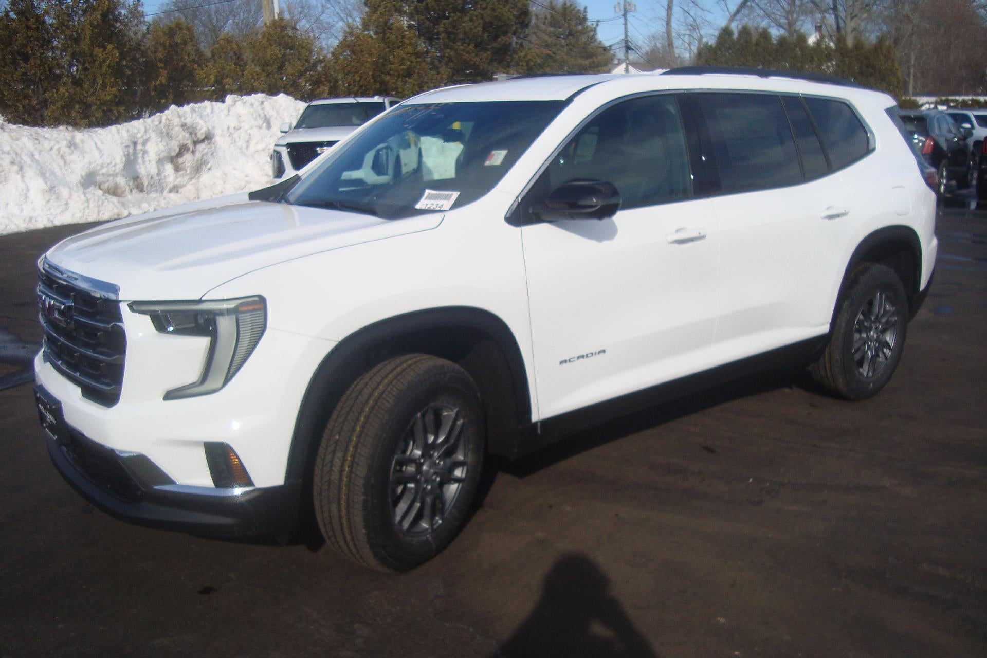 2026 GMC Acadia Elevation in Summit White — front three-quarter view