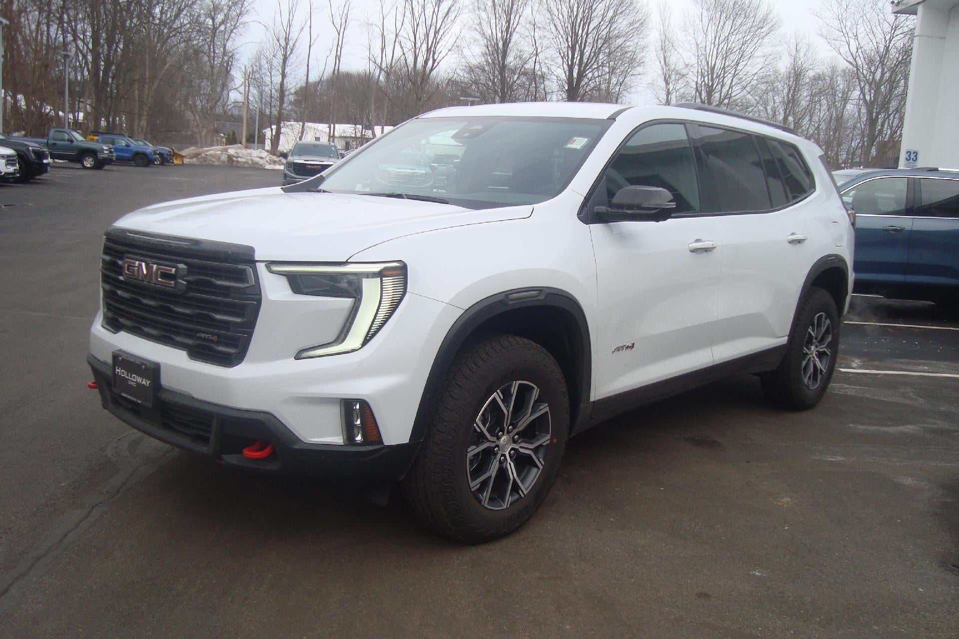 2026 GMC Acadia AT4 in Glacier White Tricoat — front three-quarter view