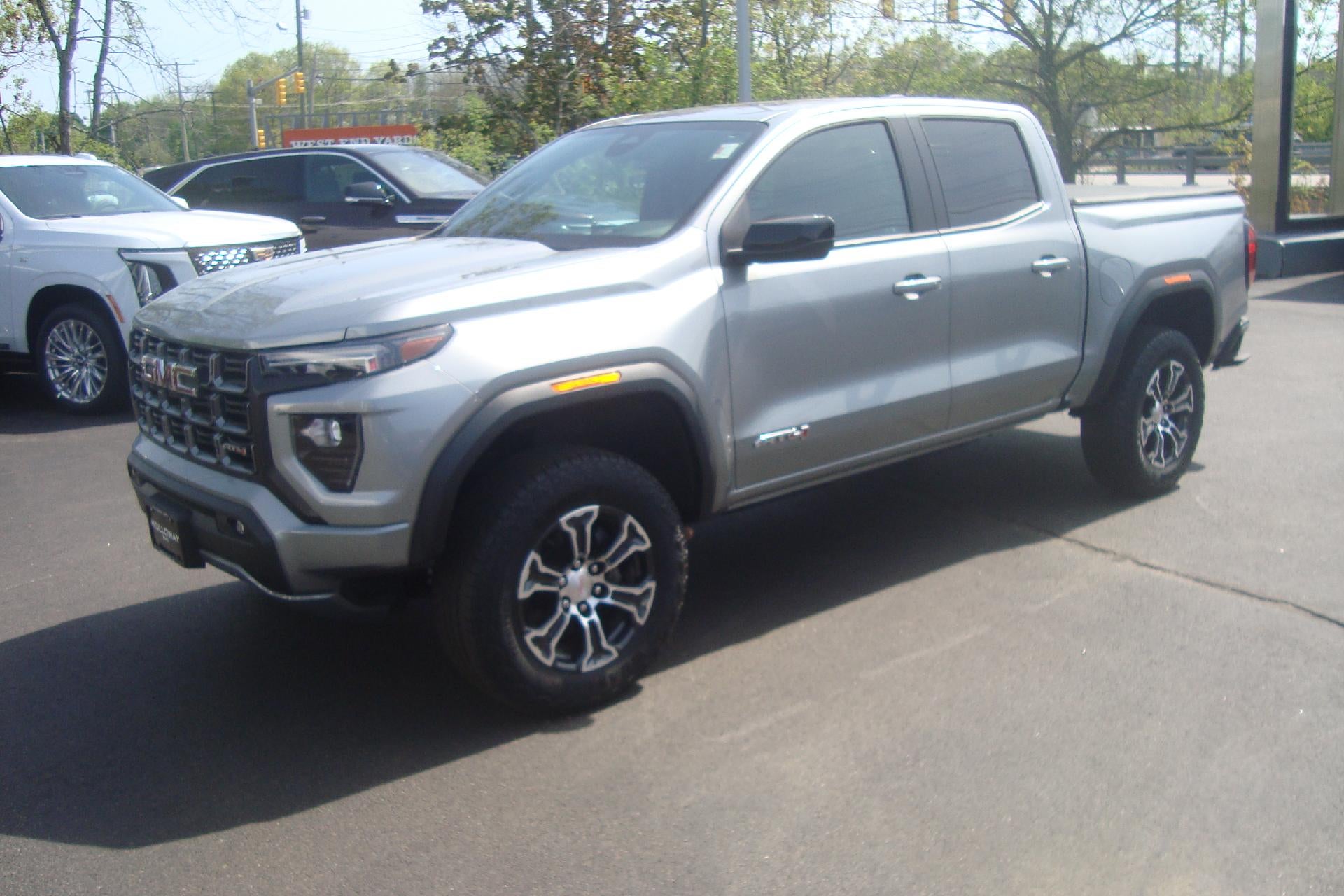 2023 GMC Canyon 4WD AT4 in Sterling Metallic — front three-quarter view