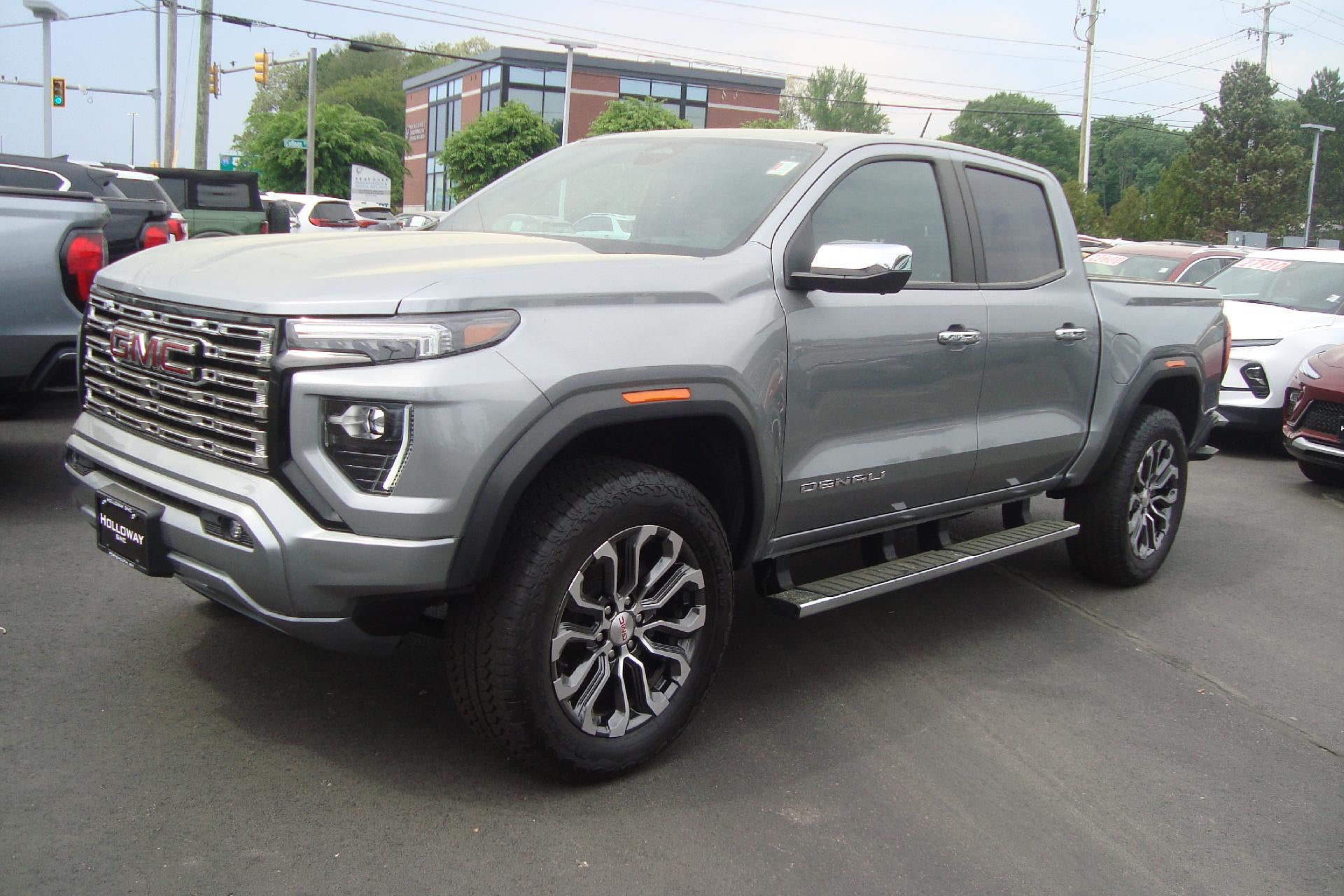 2024 GMC Canyon 4WD Denali in Sterling Metallic — front three-quarter view