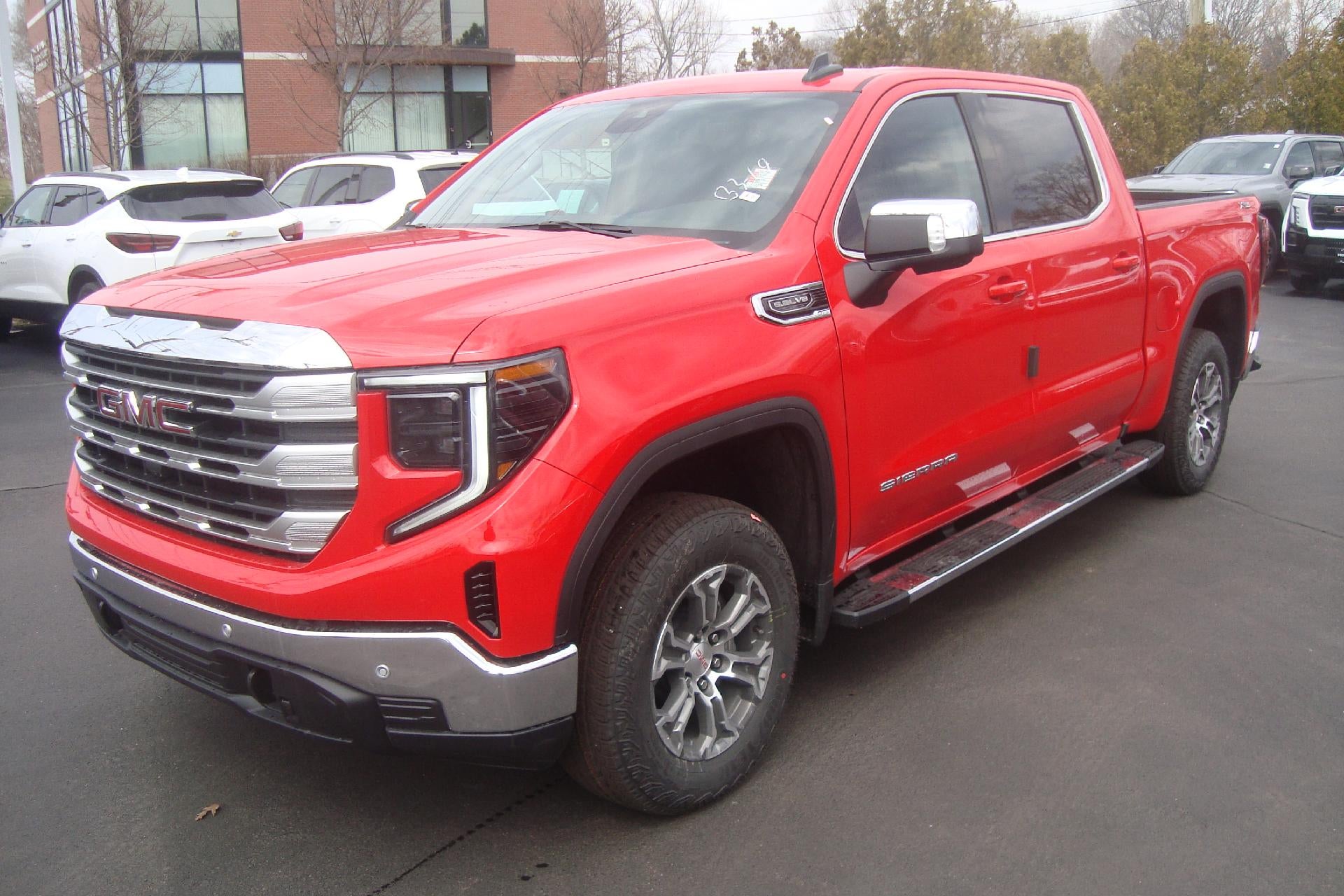 2026 GMC Sierra 1500 SLE in Cardinal Red — front three-quarter view